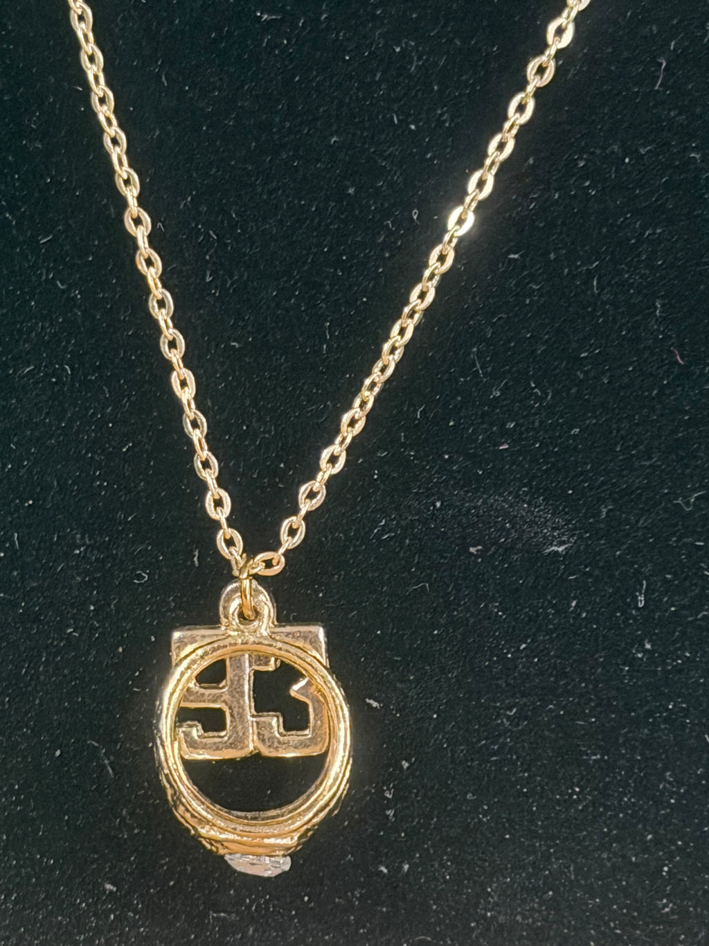 Necklace with number 93 and ring with white stone